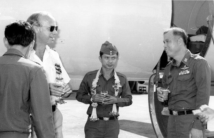 1979, Bangkok RTAF Base.  Chatting with RTAF officers on third Merlin 4A delivery.